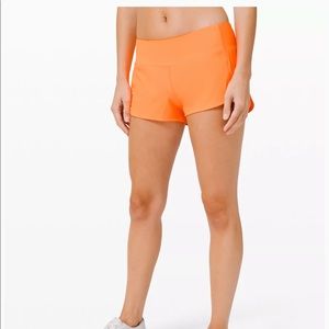 Orange Lululemon shorts